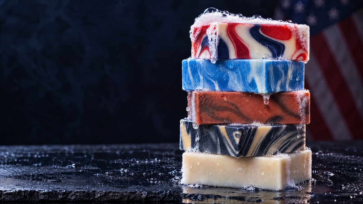 Five Right Wing Naturals soap bars stacked on wet slate with an American flag behind
