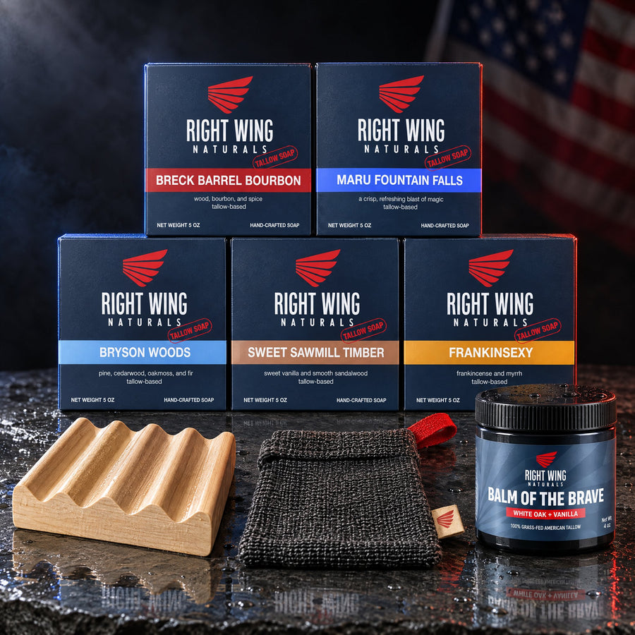 The Tallow Reserve beef tallow soap set with five boxed tallow soap bars, a wooden soap dish, an exfoliating pouch and a jar of Balm of the Brave